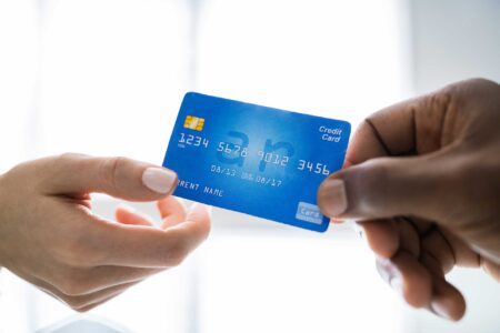 Handing a debit card