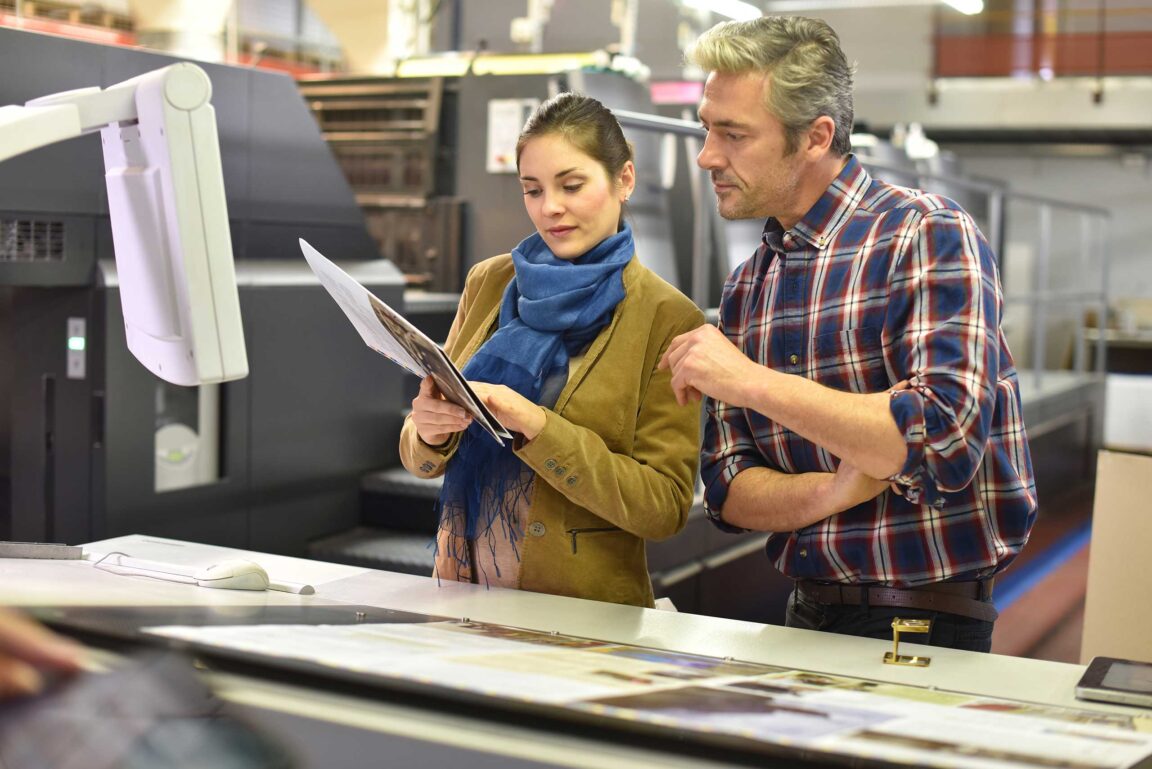 Man and woman looking at document